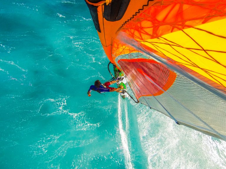 Top mounted camera photo of windsurfing riding on the on turquoise water