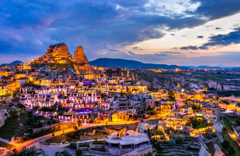 View of Uchisar with the castle at sunset. Cappadocia, Turkey